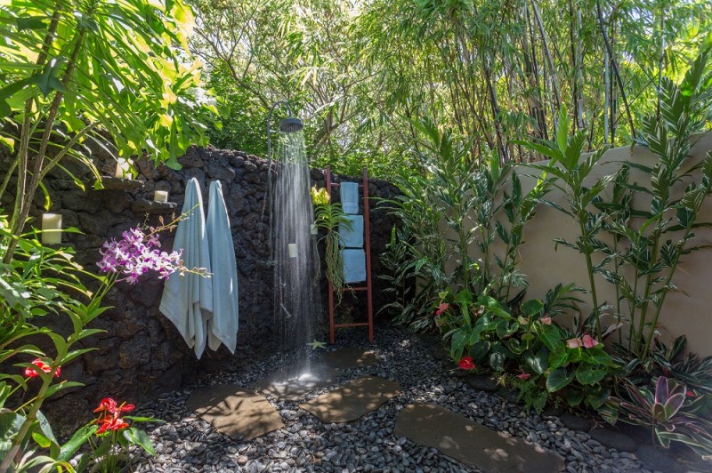 Waterfall shower with a vibrantly green ambiance