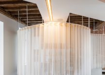 White-ceiling-lighting-with-golden-glint-and-smart-design-transform-the-industrial-space-217x155