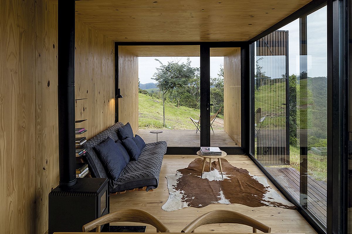 Wood clad interior of the prefab unit with gorgeous mountain views