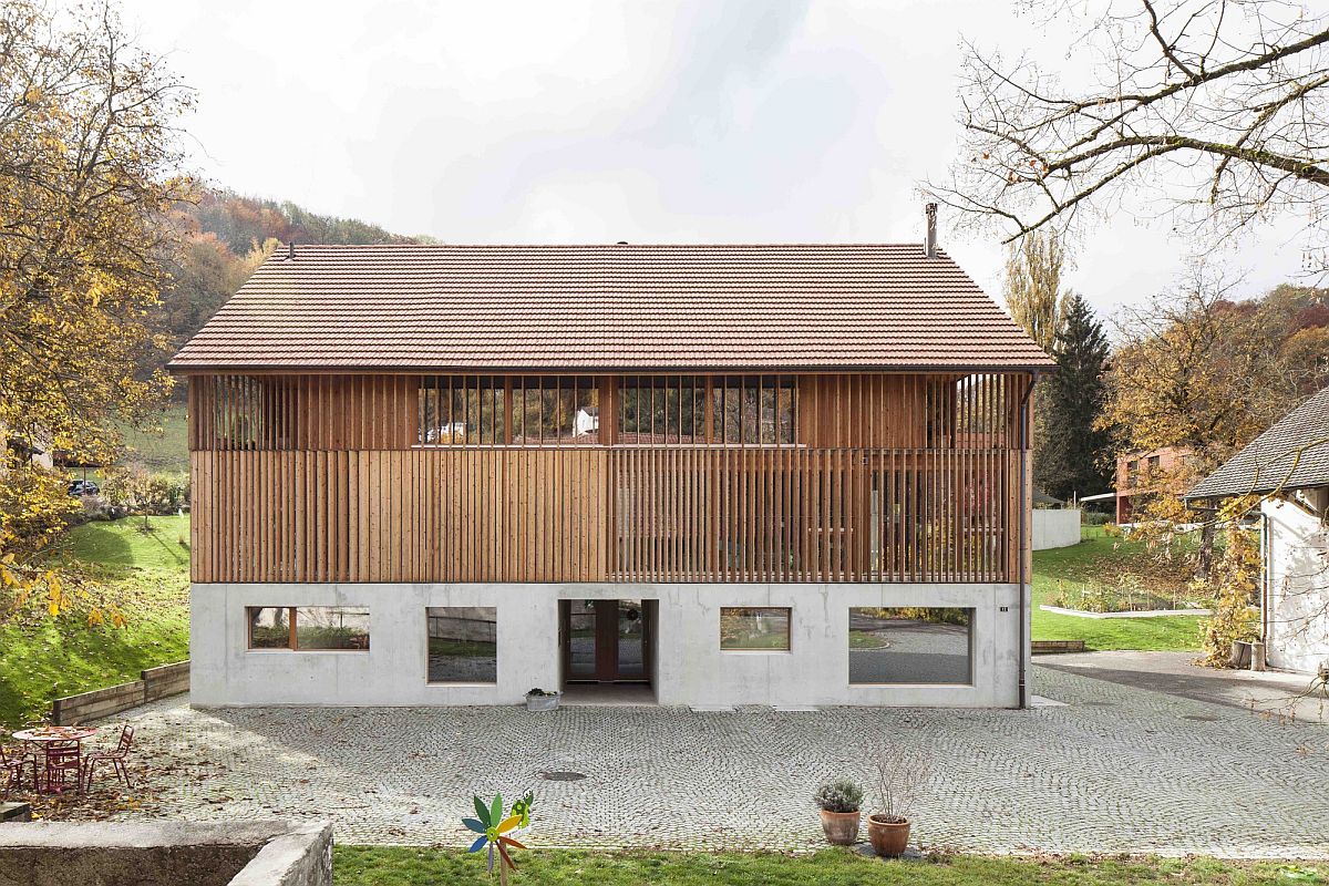 Wooden slats and tiled roof give the converted barn a classic appeal