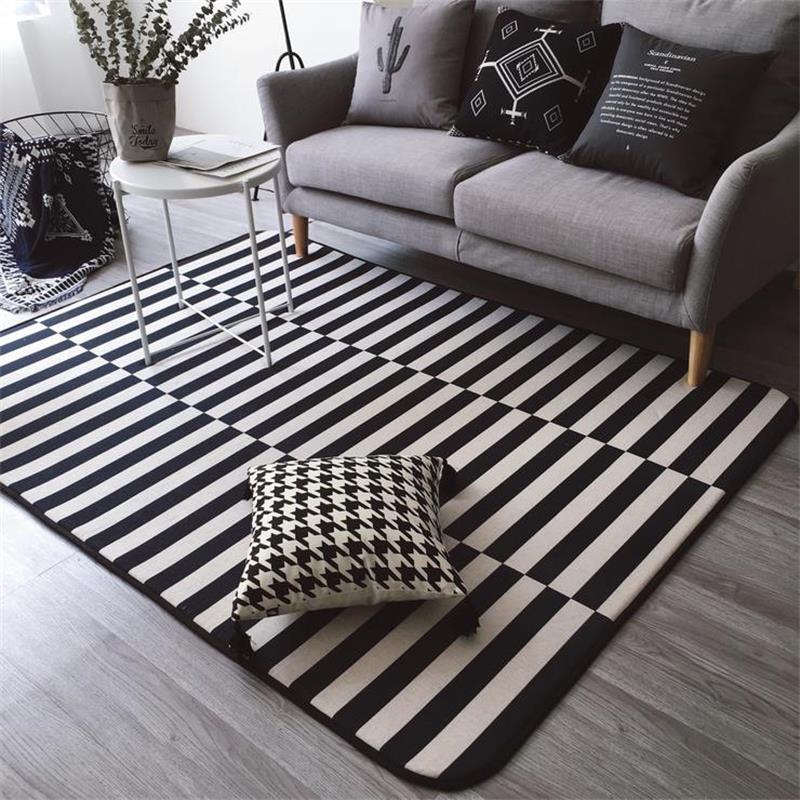 A charming neutral living room with a stylish striped rug