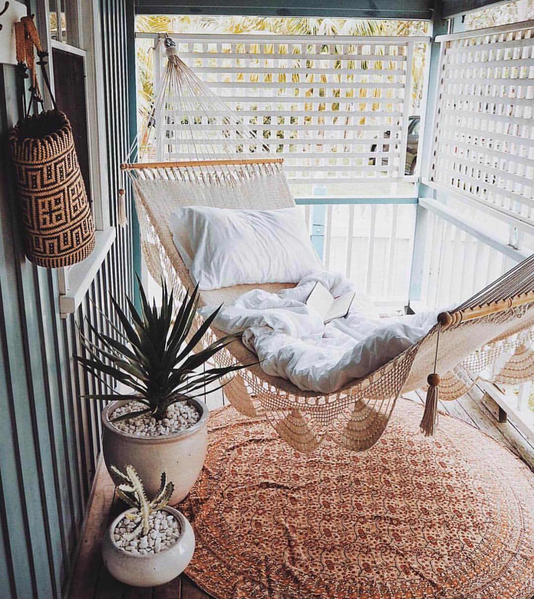 A chic hammock on a boho balcony