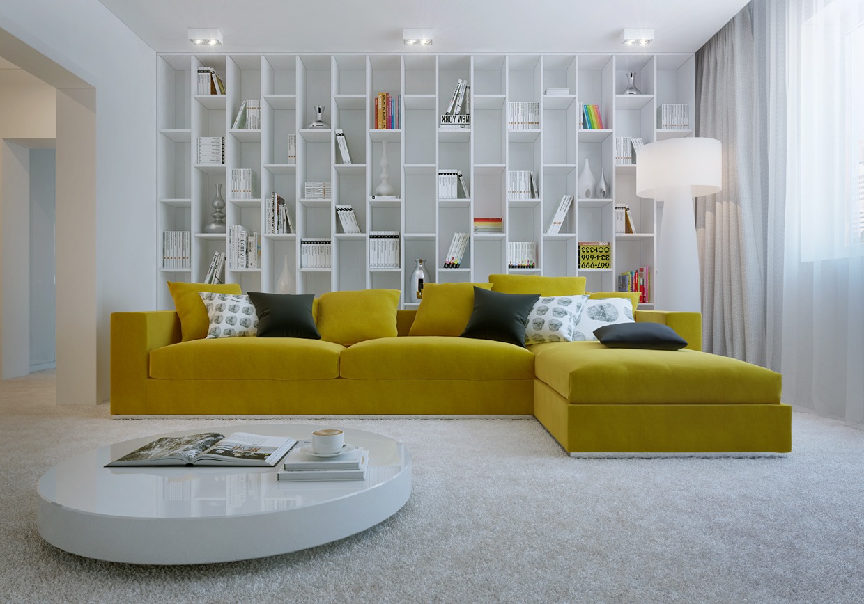 A giant yellow sofa in a big and bright book corner