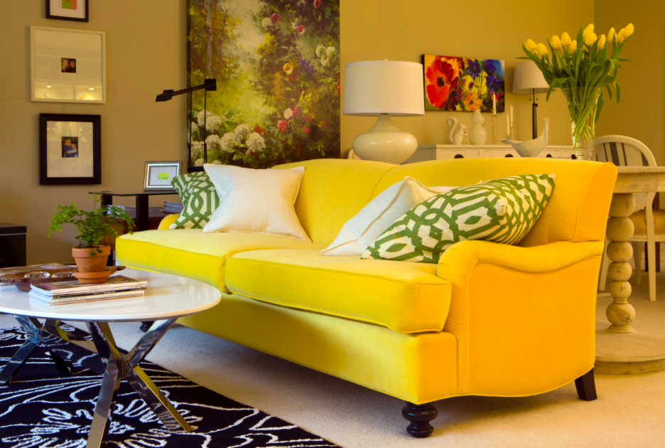 A sofa with a vintage design and bold modern yellow color