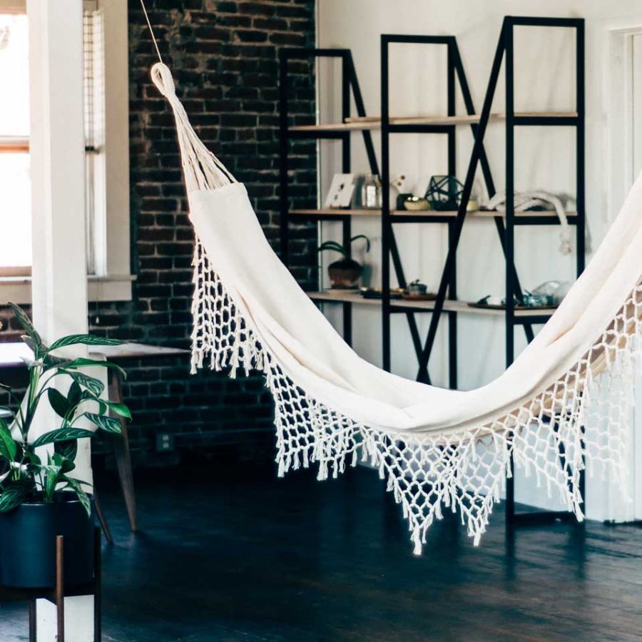 A-white-hammock-with-a-net-fringe-