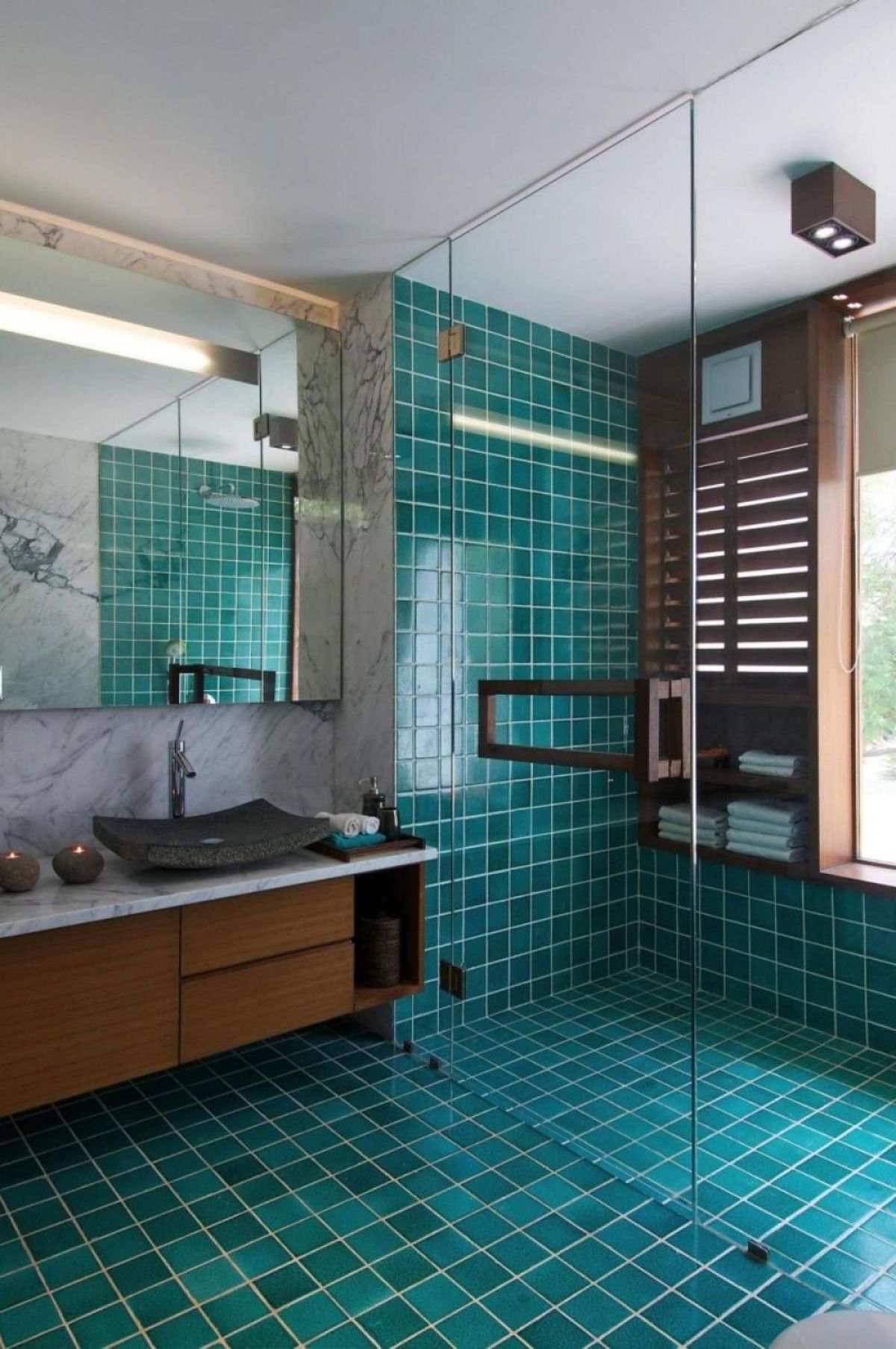 Bathroom with turquoise tiles and marble counter