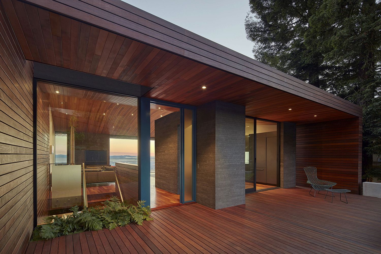 Beautiful wooden deck and ceiling give the modern home plenty of warmth visually