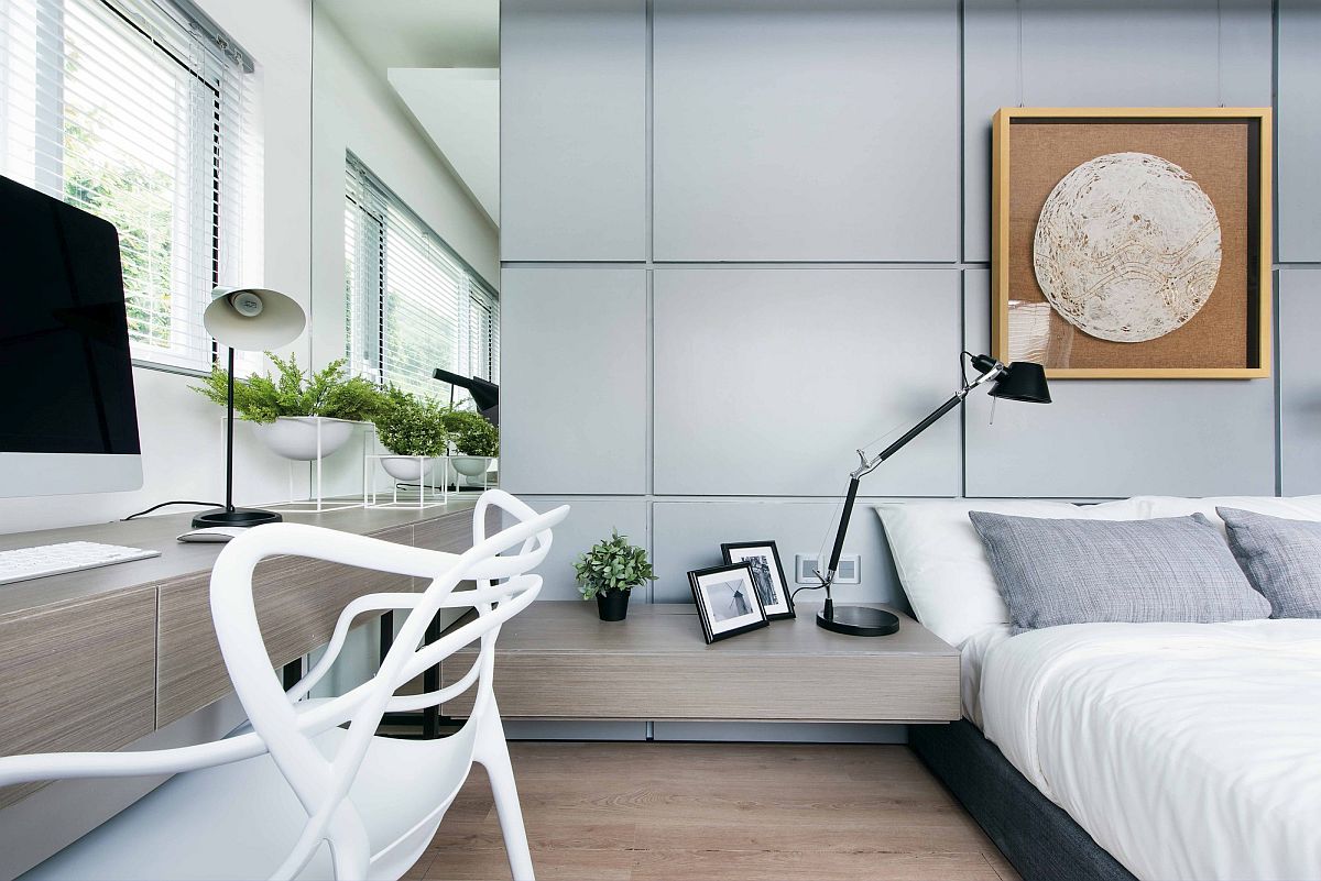 Bedroom in white and bluish-gray with workstation