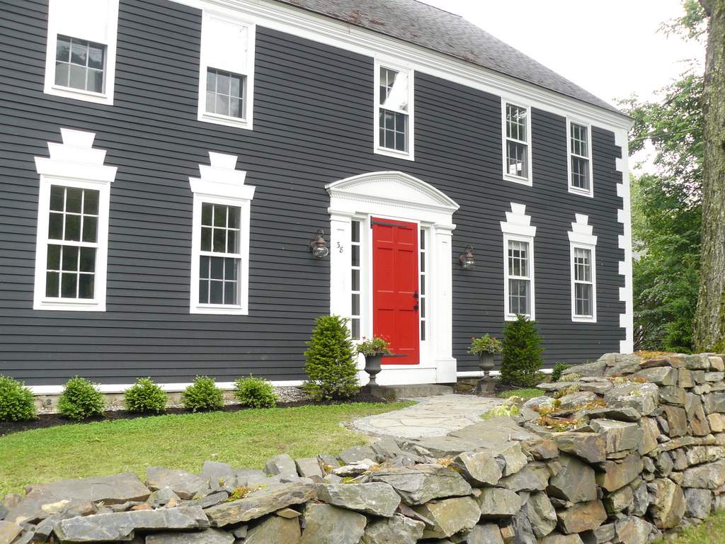 Big-gray-house-with-bright-red-doors-as-a-focal-point-