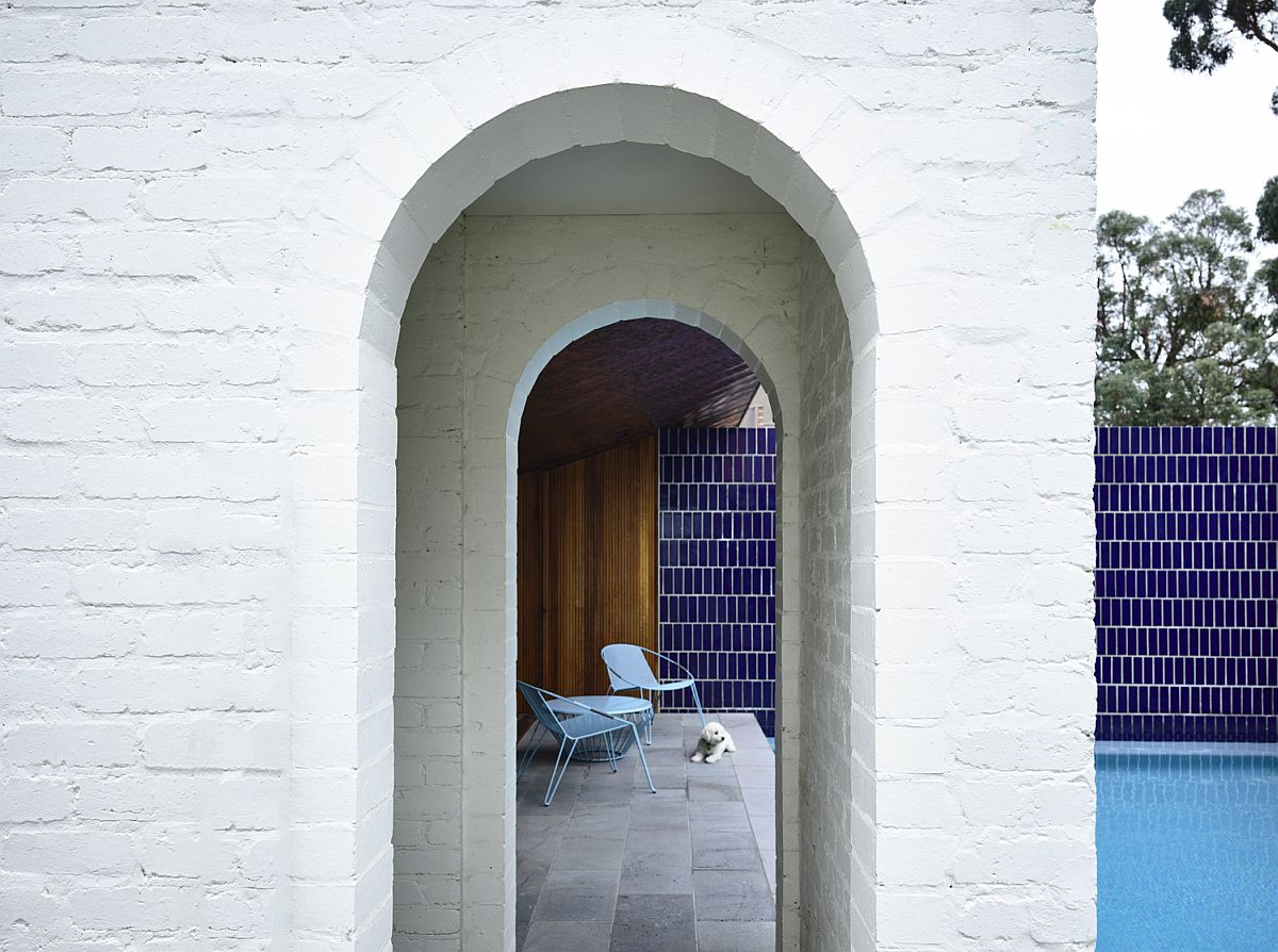 Brick wall chimneys and archways give the patio and pool area a classic vibe