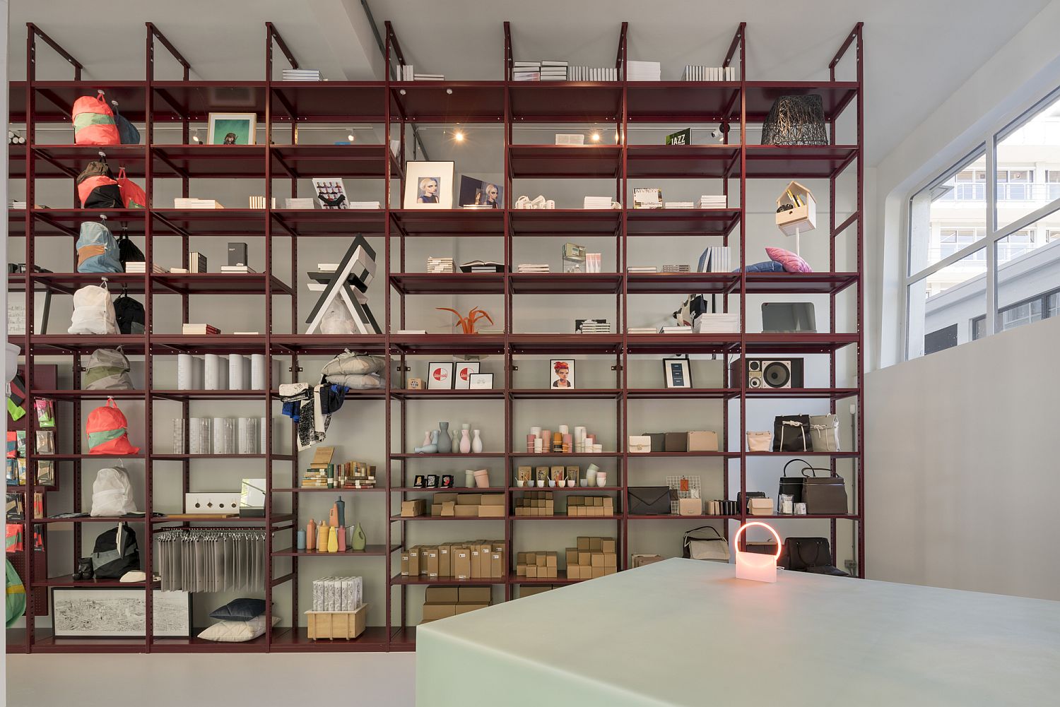 Bright red shelves display the best art and craft creations of the city