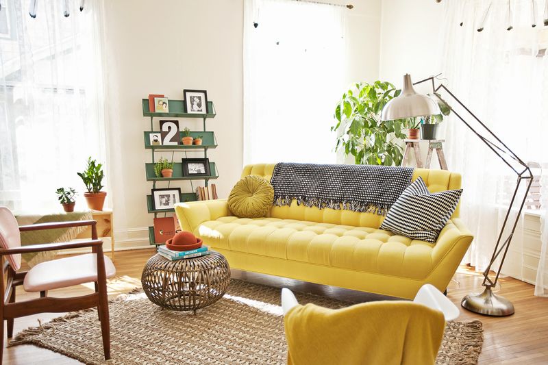 Bright yellow sofa makes the living room feel inviting