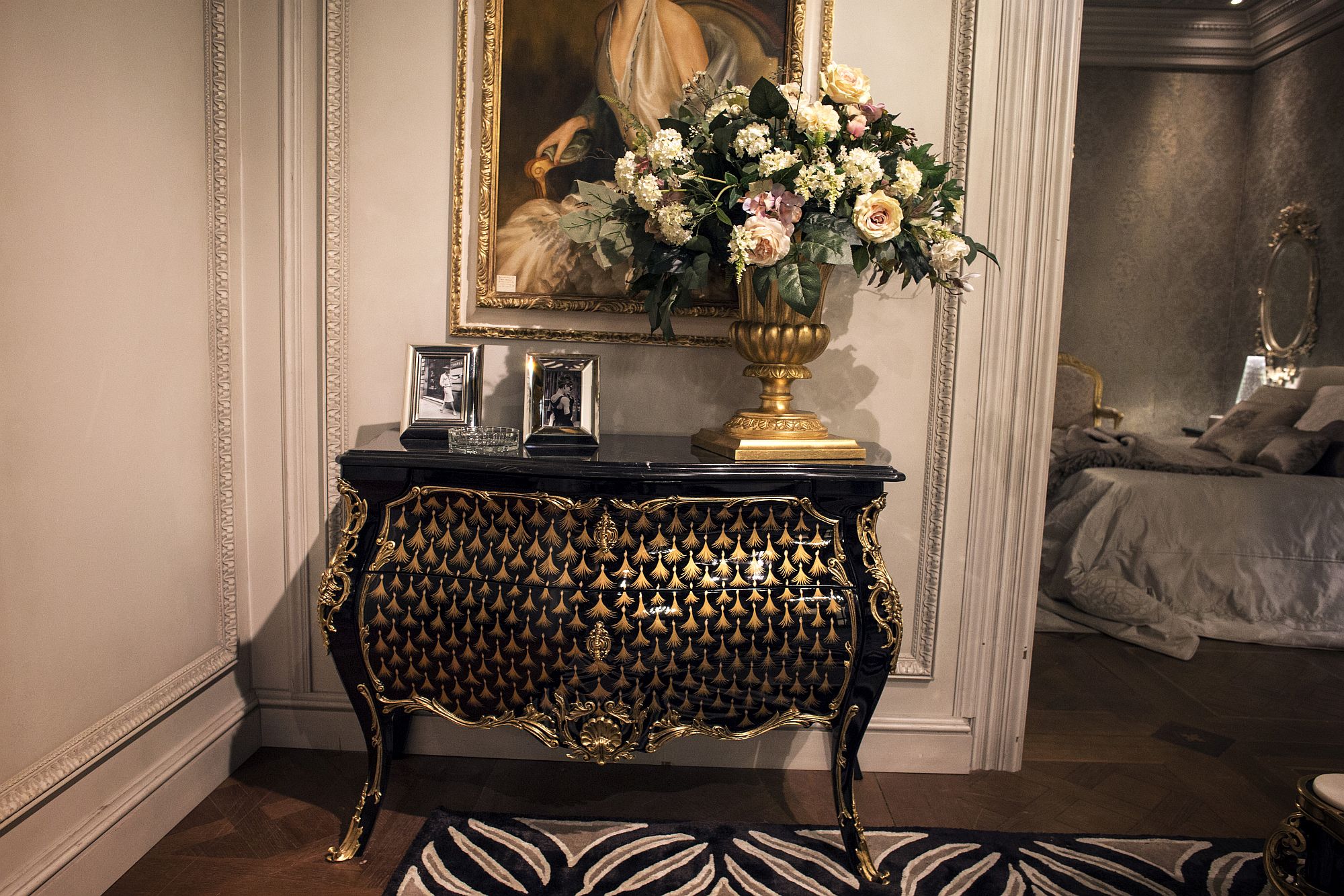 Classic entry console table in balck and gold decorated beautifully