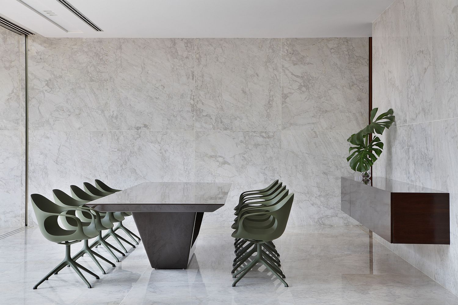 Contemporary minimal dining area with chairs in light pastel green