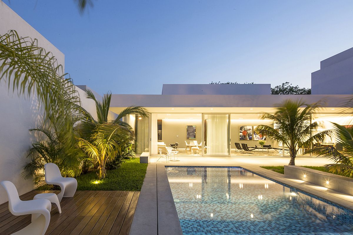 Contemporary outdoor chairs and small side table for the poolside deck