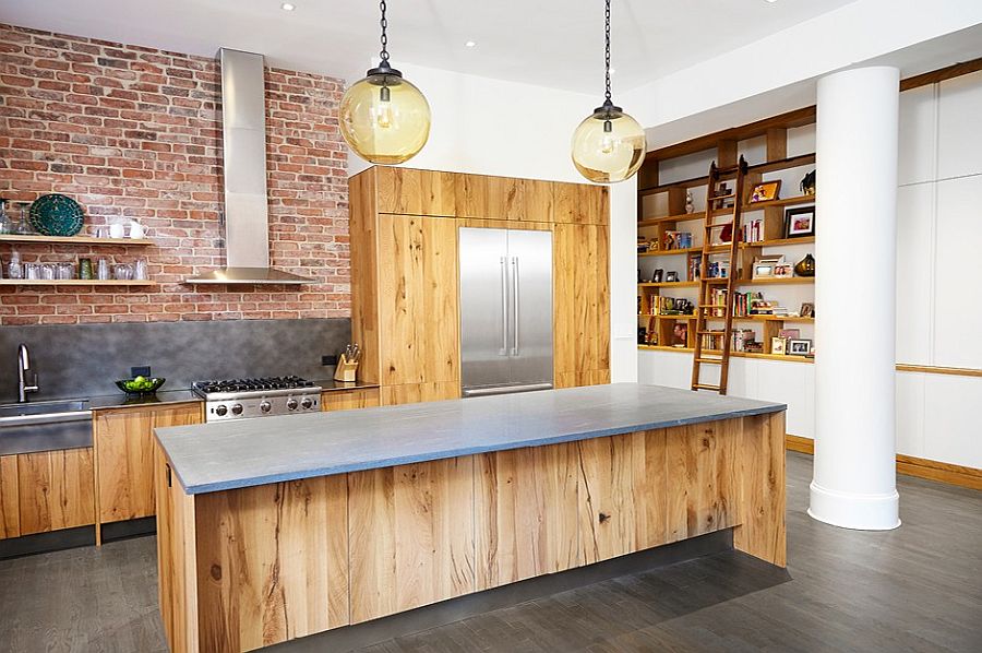 Exposed brick wall along with wooden island and shelves gives the kitchen plenty of contrast