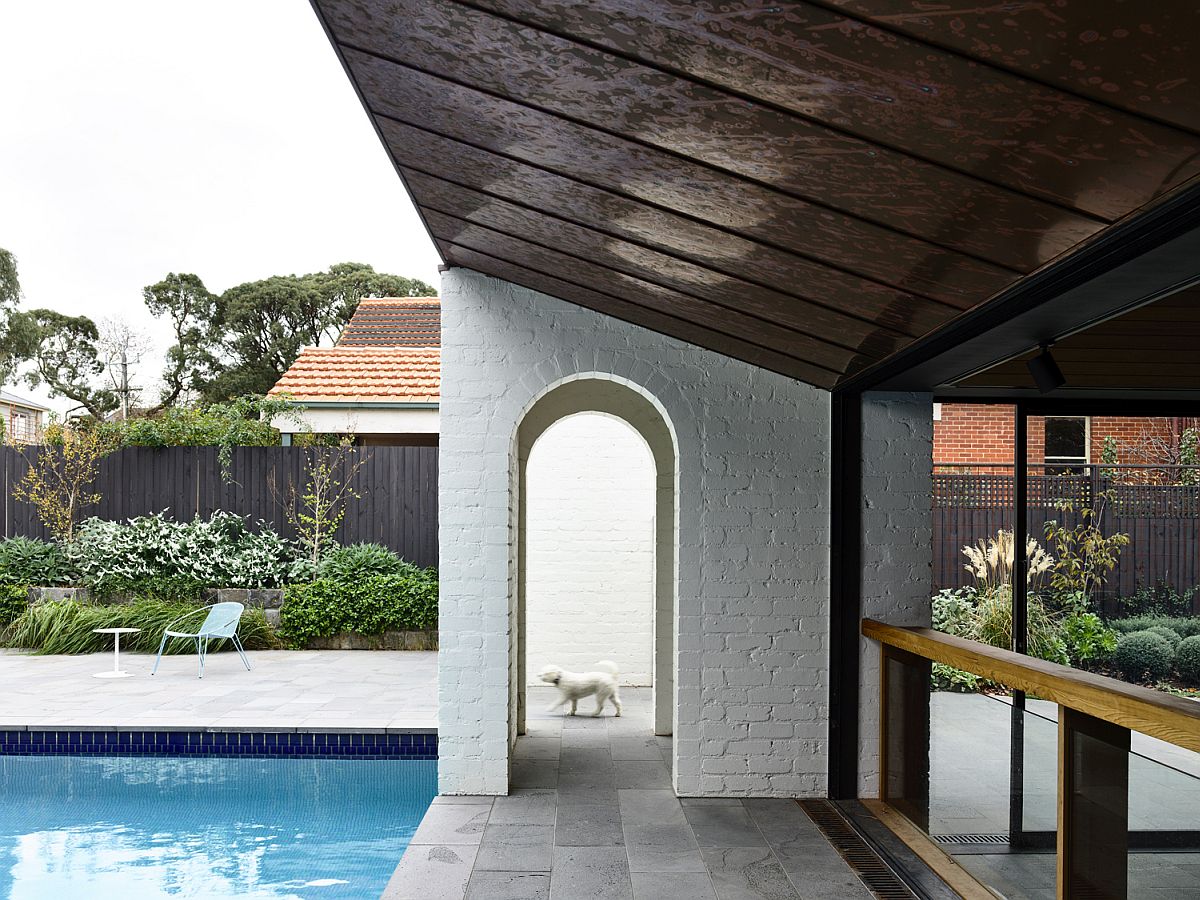 Fireplace, chimney and outdoor hangout next to the pool