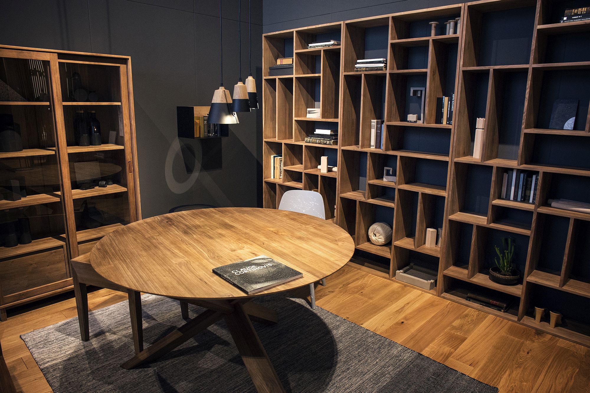 Floor to ceiling open wooden shelves make a big visual statement