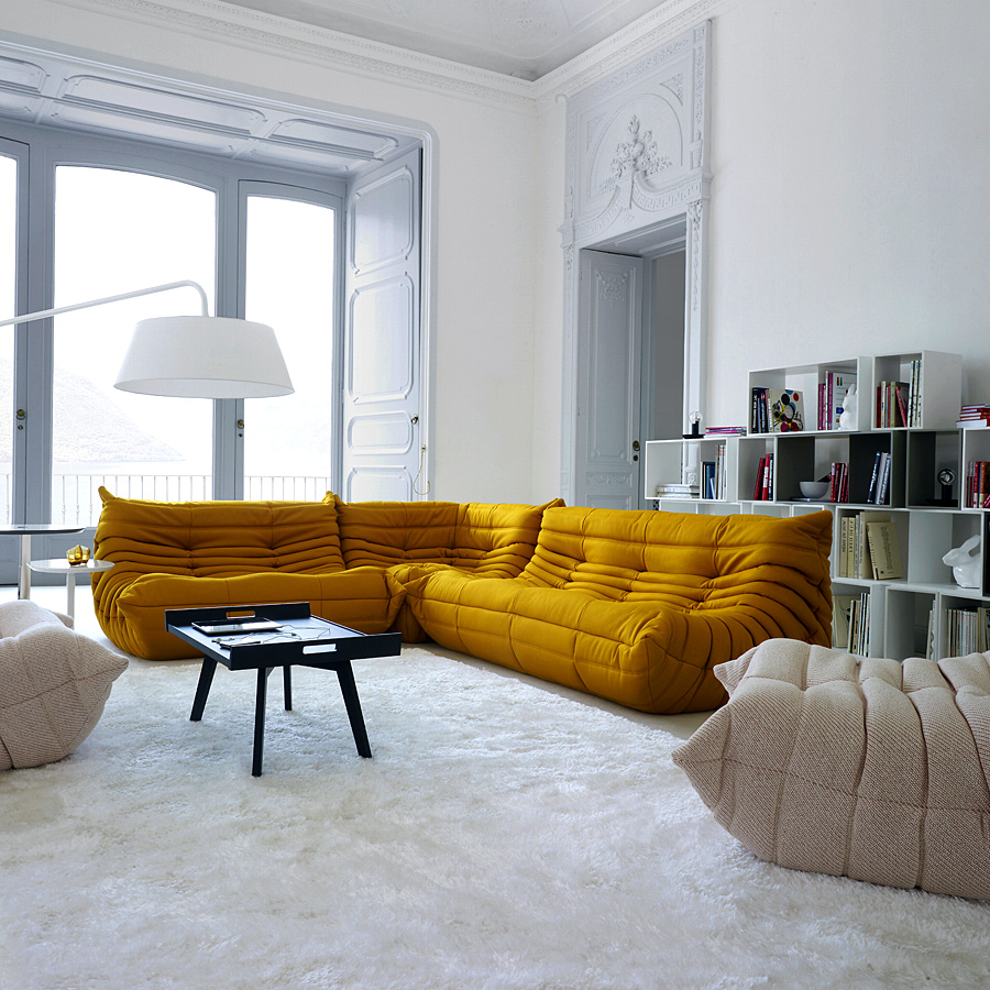 Gold yellow sofa is the highlight of the room