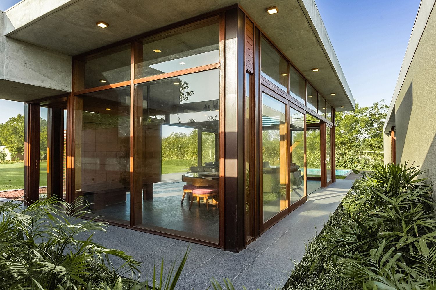 Large-glass-walls-and-sliding-doors-bring-the-outdoors-inside