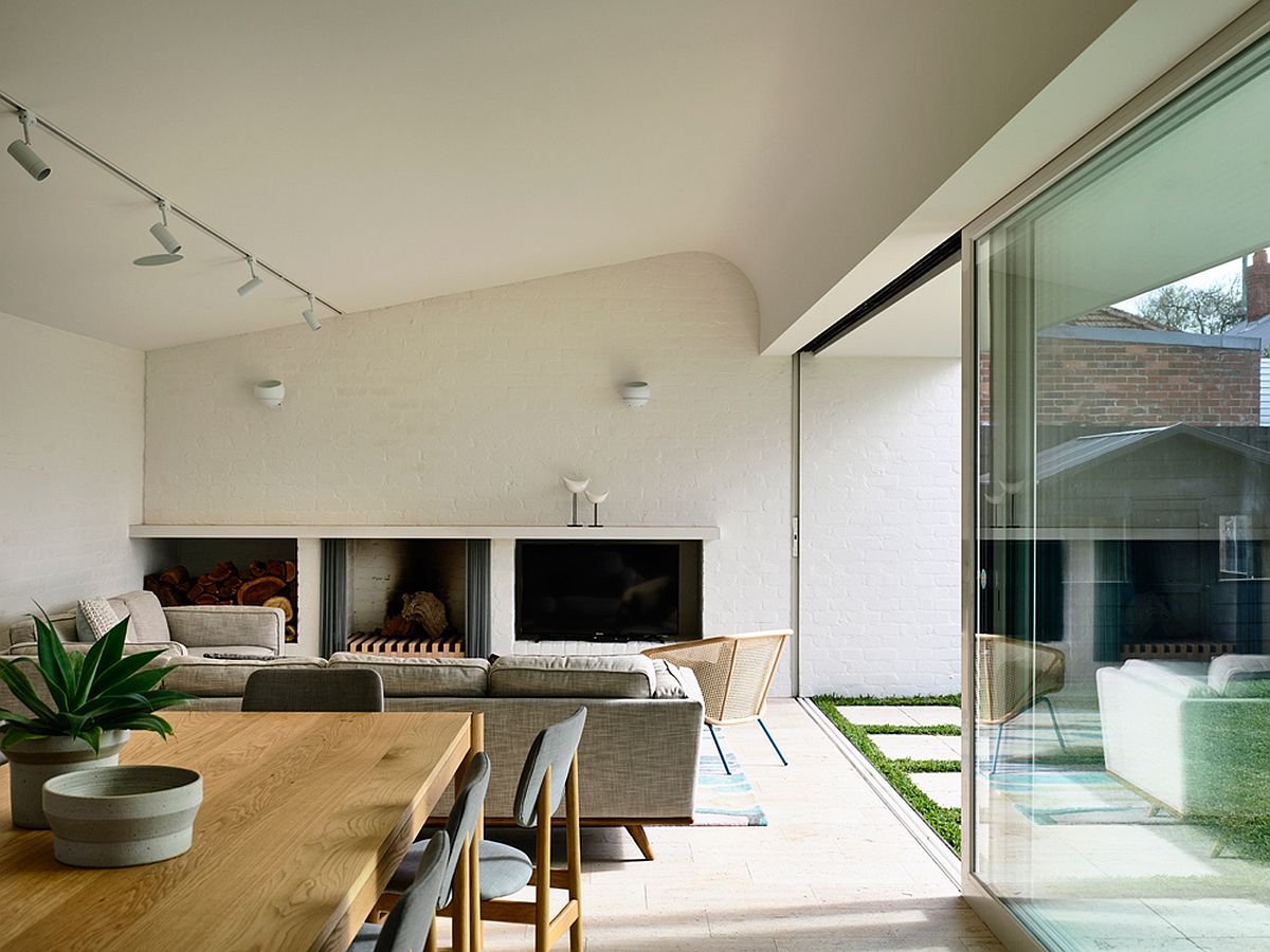 Living room with unique ceiling and track lighting