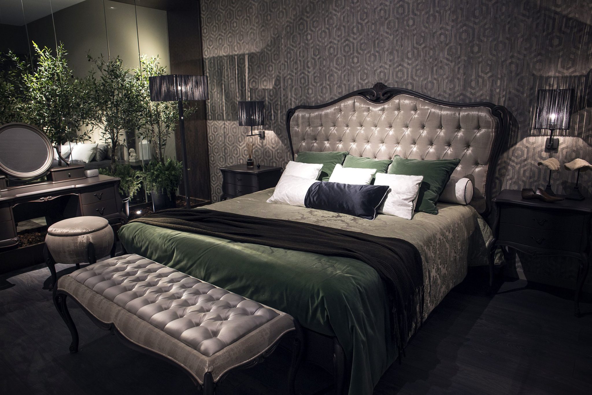 Modern touches and gray coupled with luxurious overtones in this stylish bedroom