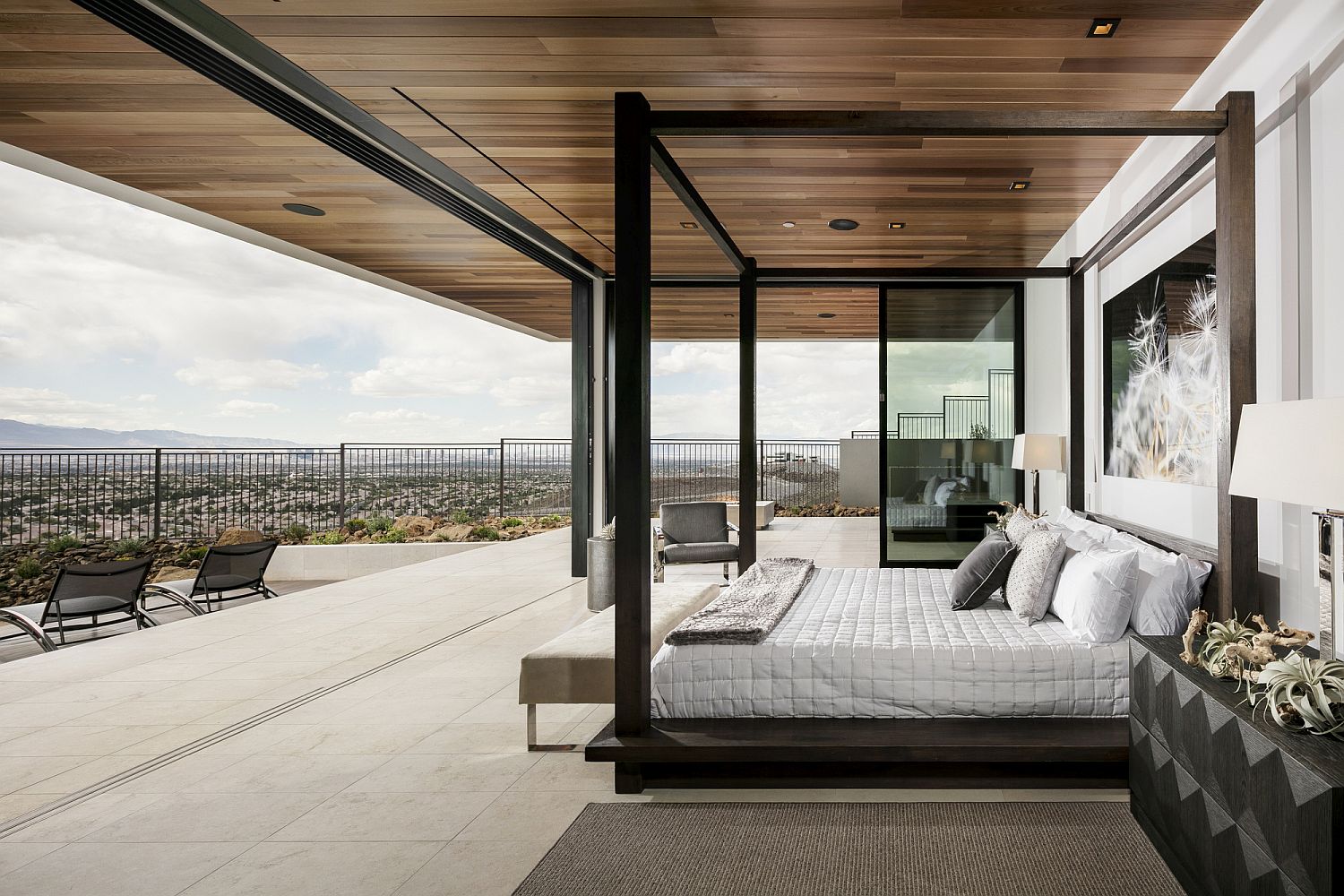 Open master bedroom design with stunning view of desert and Las vegas Strip