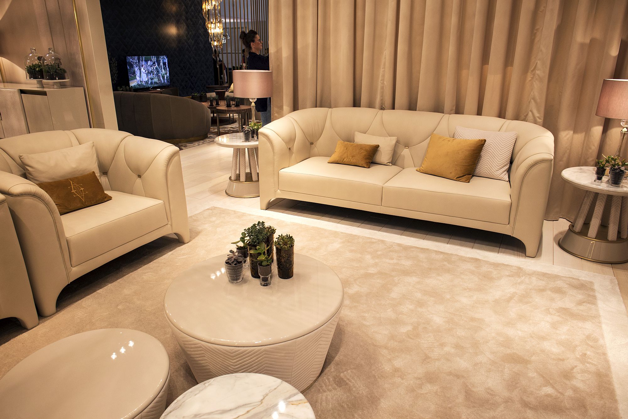 Plush couch in white with accent pillows in gold