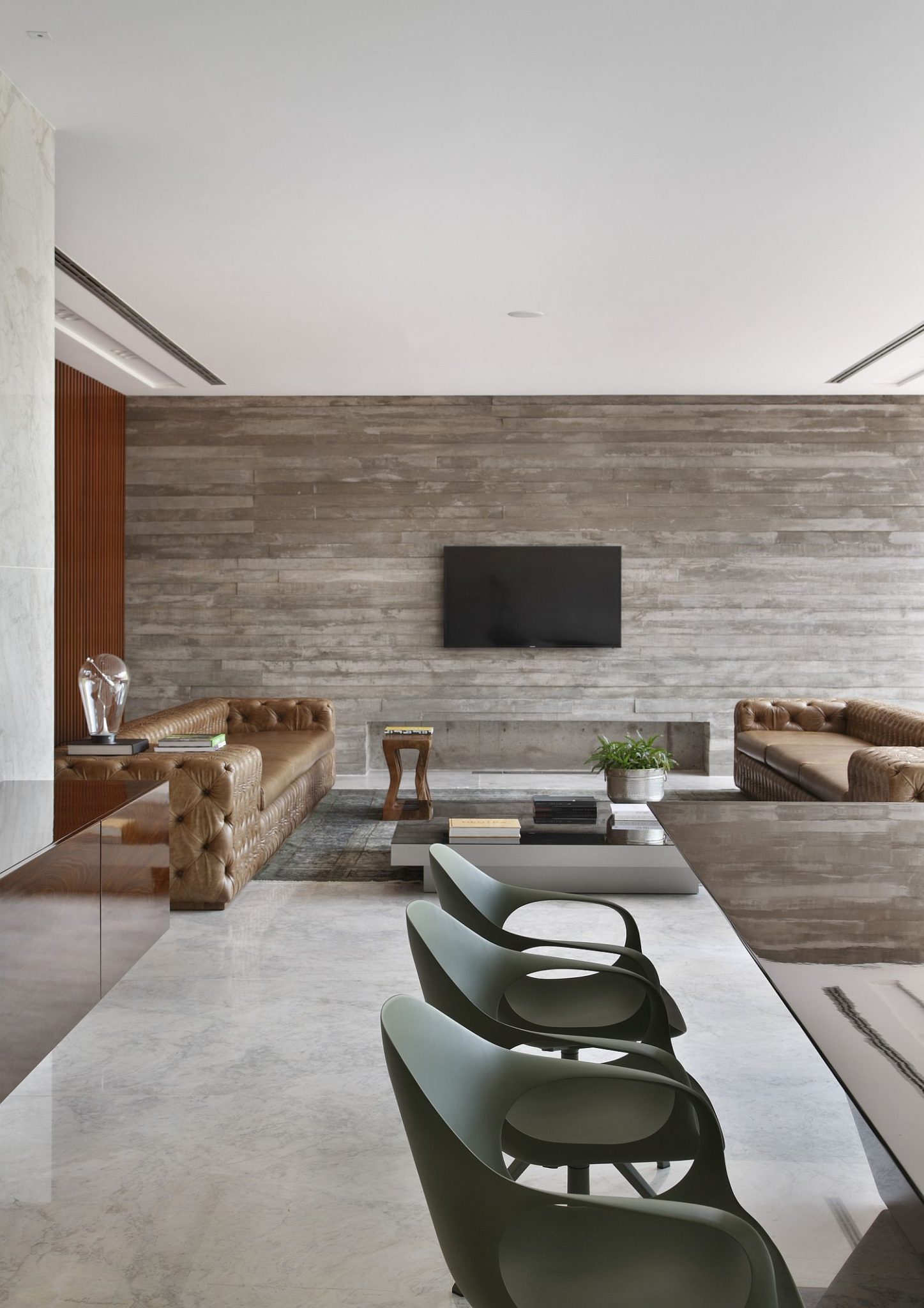 Reclaimed wood and concrete create an elegant living area