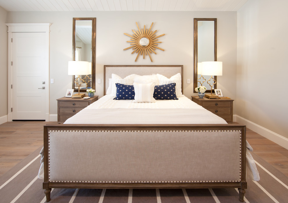 Shiny-sunburst-mirror-in-a-beige-bedroom