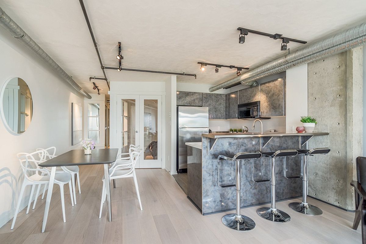Simple kitchen and dining area arrangement of the industrial apartment