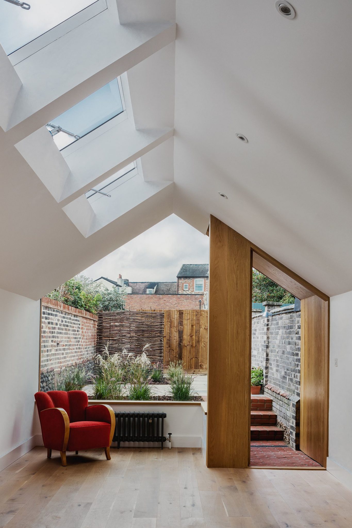 Small rear garden along with the kitchen and dining of the contemporary extension