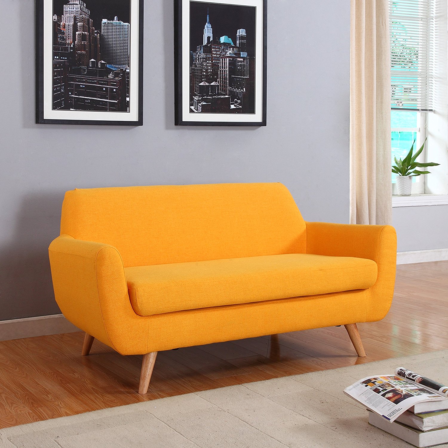 Sofa-in-an-almost-orange-shade-of-yellow-within-a-modern-living-room