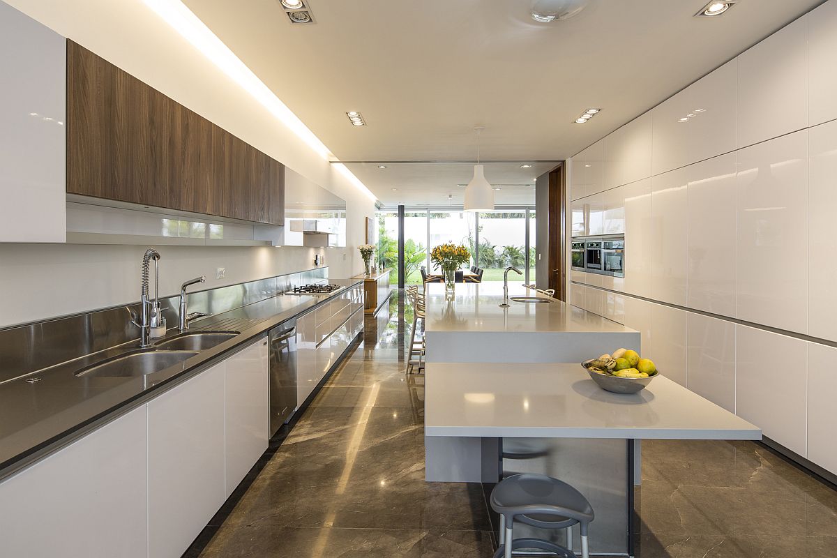 Spacious contemporary kitchen in white with a dashing breakfast bar