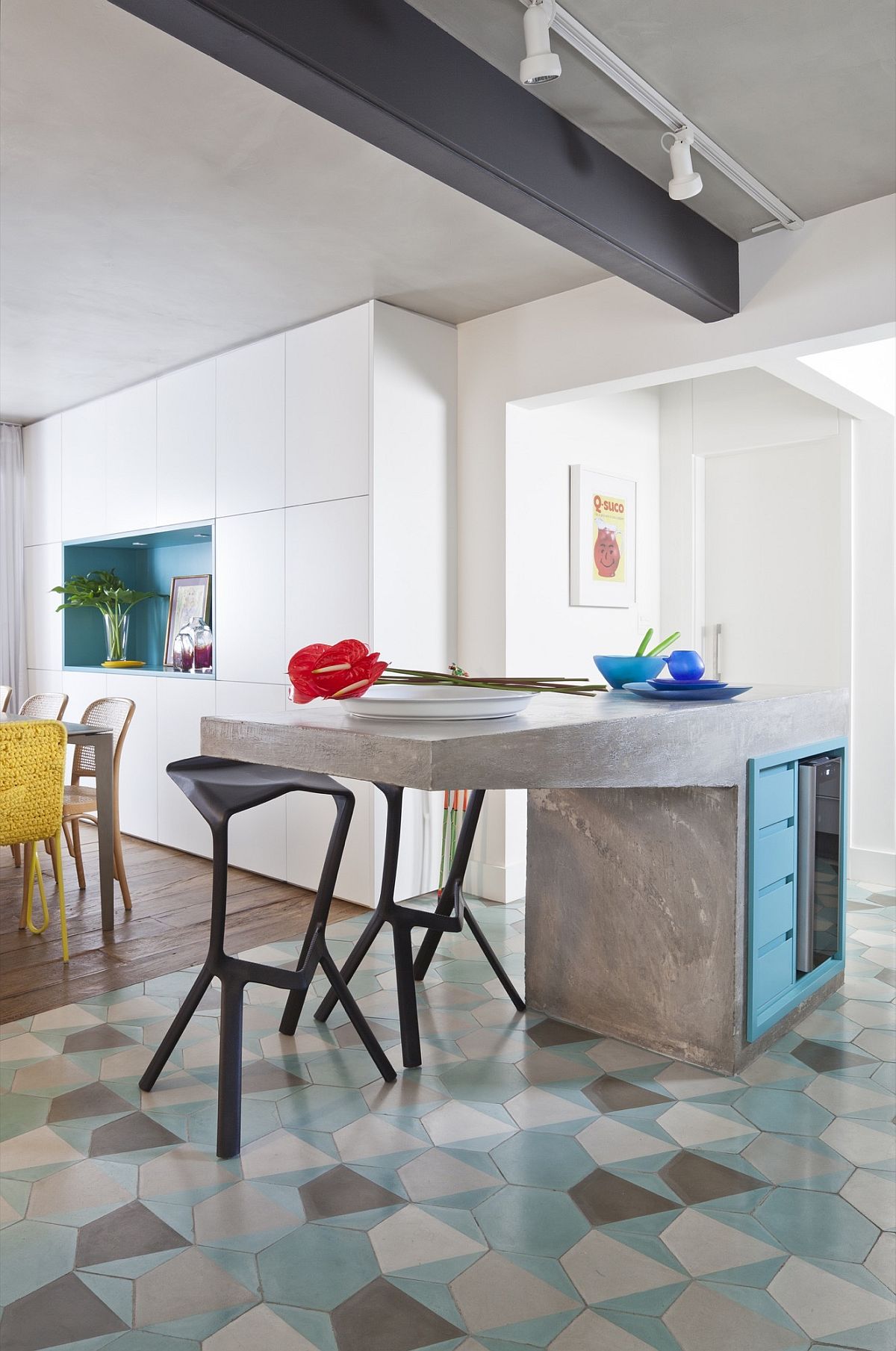 Super cool cement kitchen island along with hexagonal floor tiles