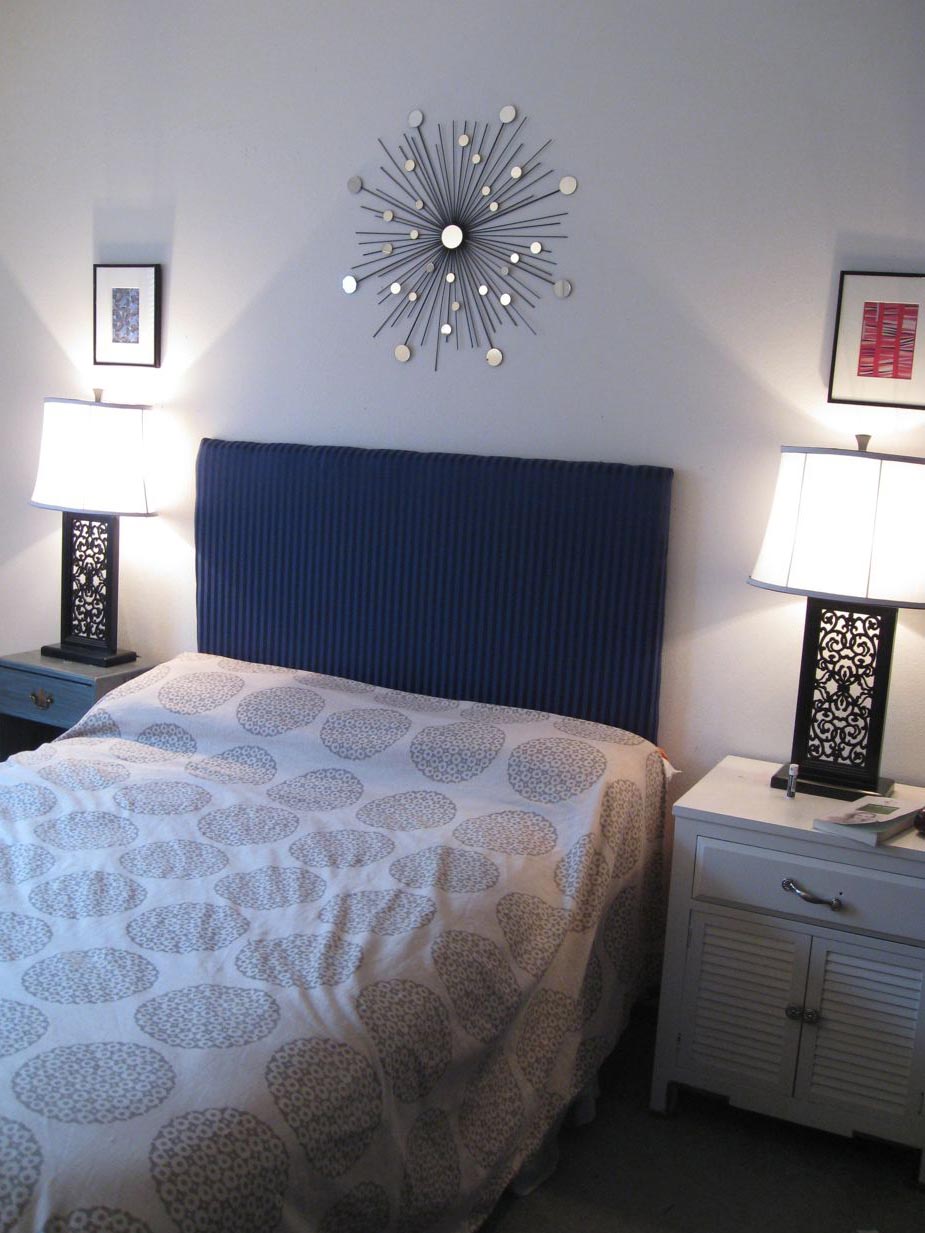 Tiny-silver-sunburst-mirror-impacts-the-bedroom