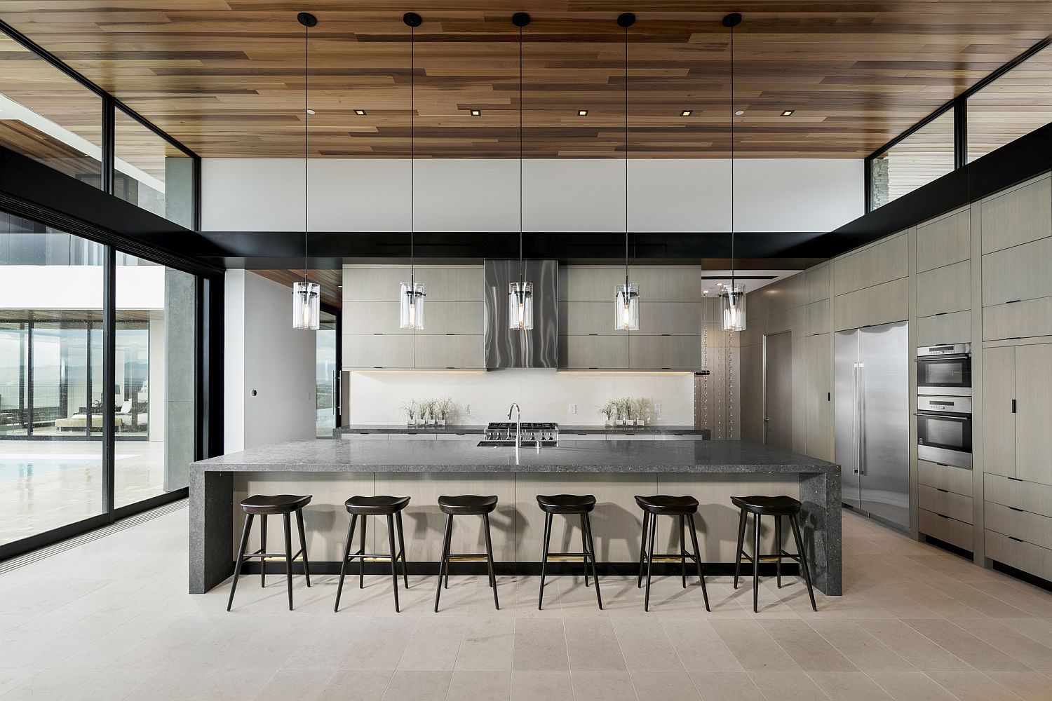 White kitchen with stone countertop for the kitchen island