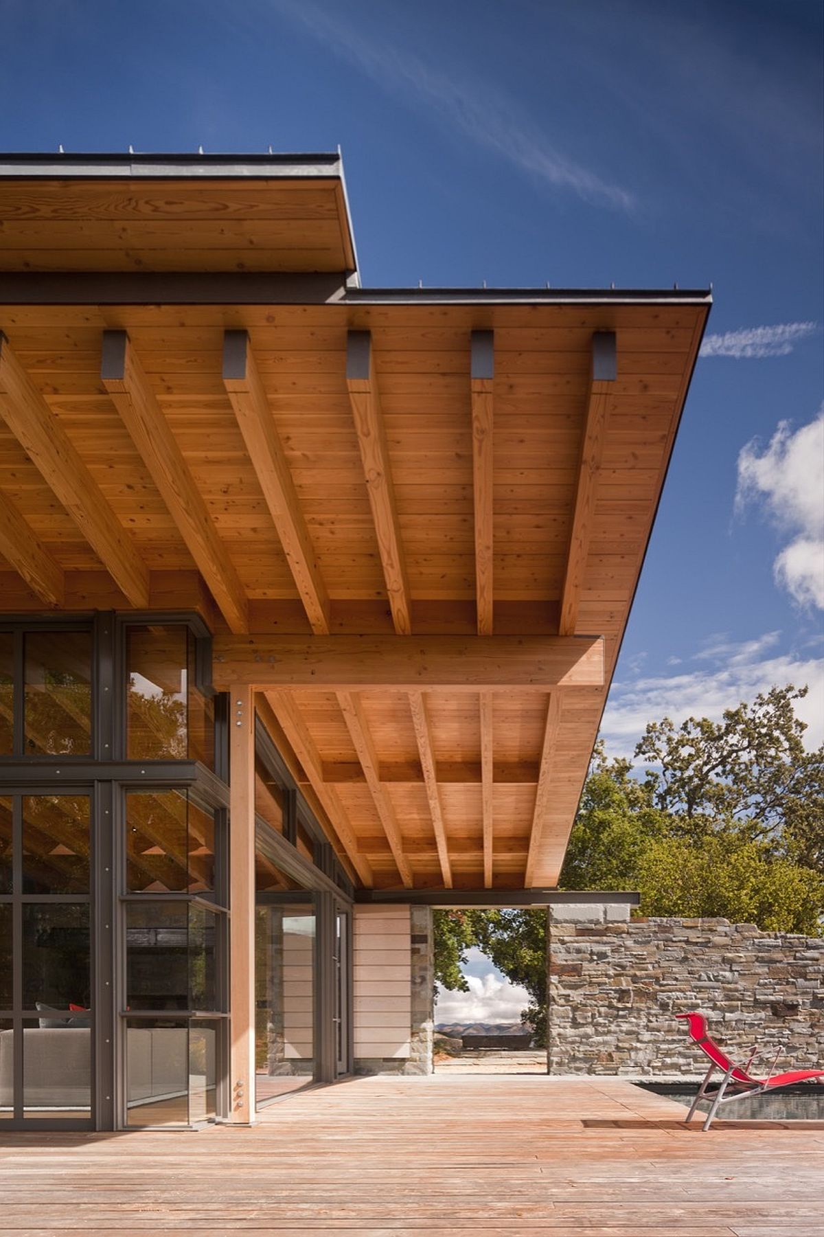 Wooden overhang offers natural shade to those on the deck