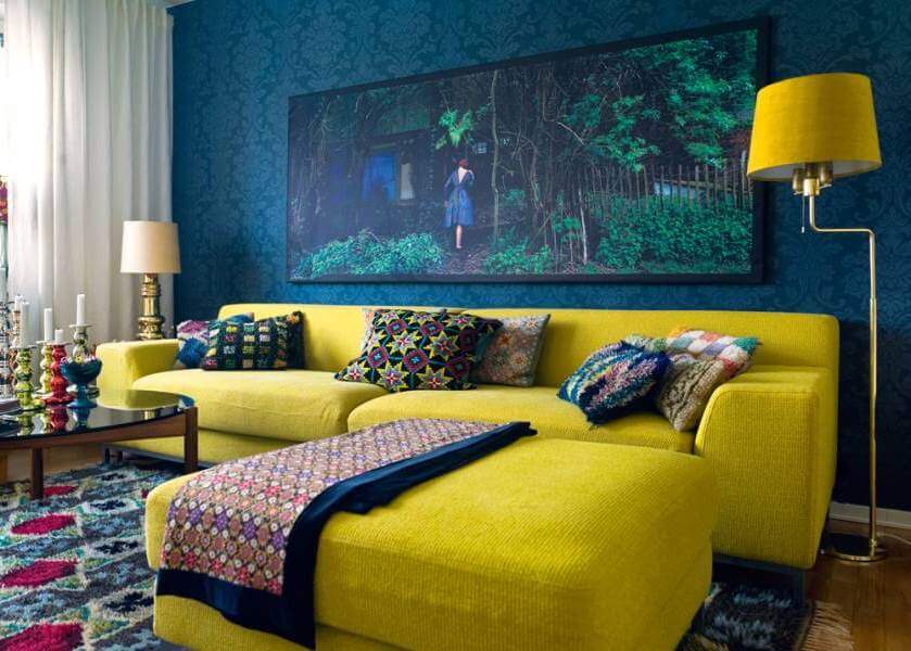 Yellow sofa in a darker room with a moody interior
