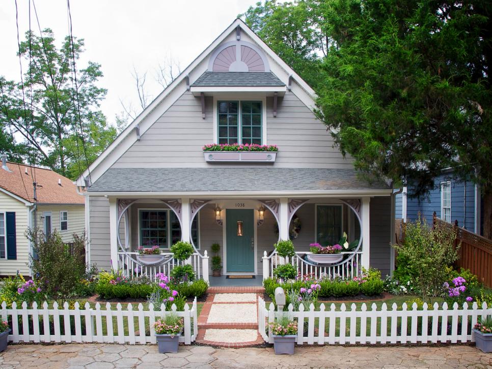 A charming little house with a white picket fence