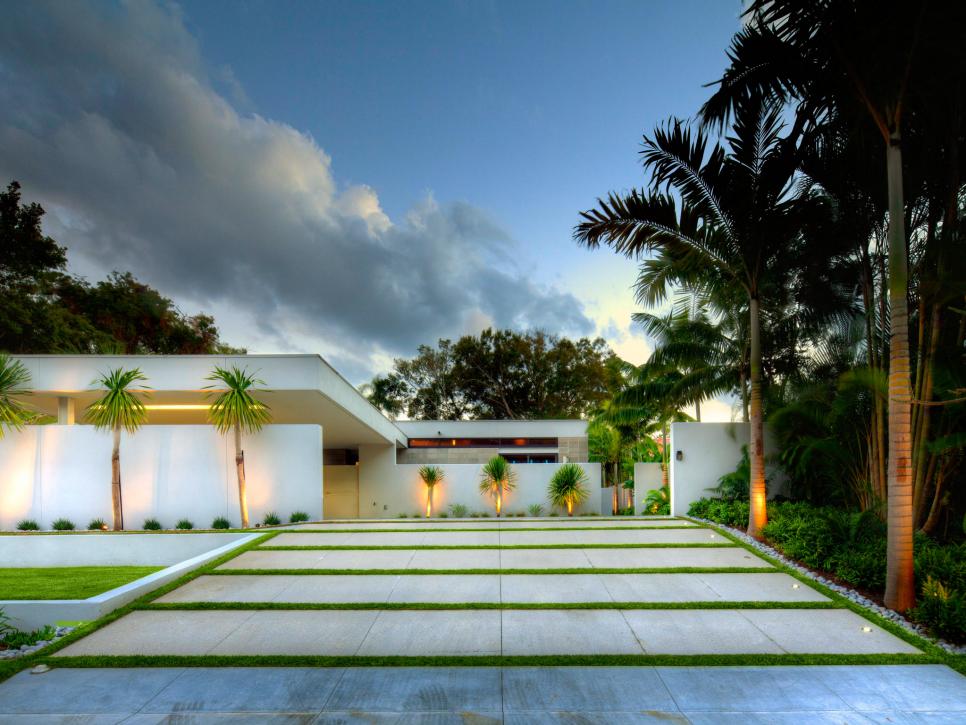 A modern driveway surrounded by palm trees