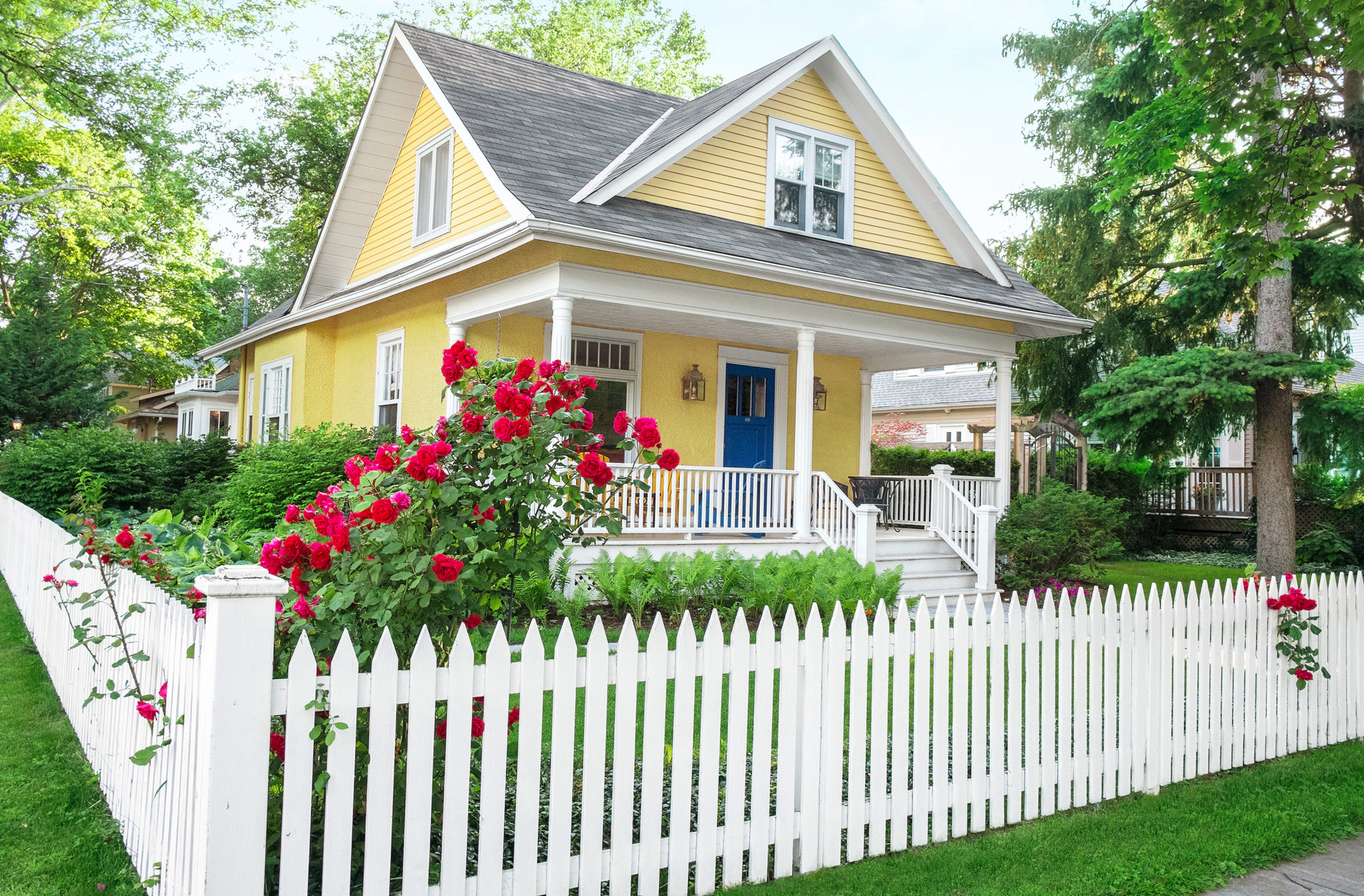 A white picket fence creates an enchanting setting