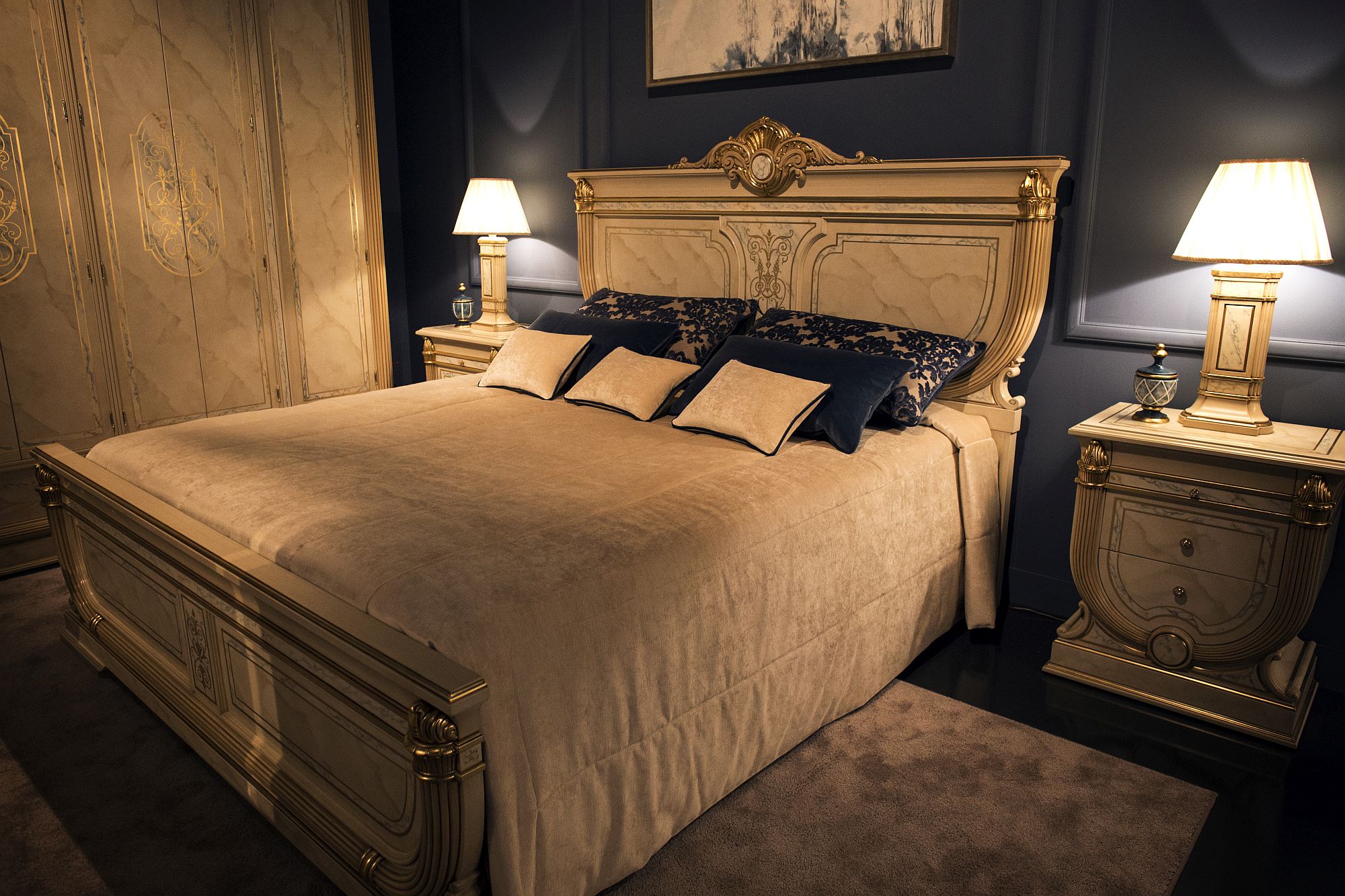 Bedside tables with matching table lamps for the lavish, traditional bedroom