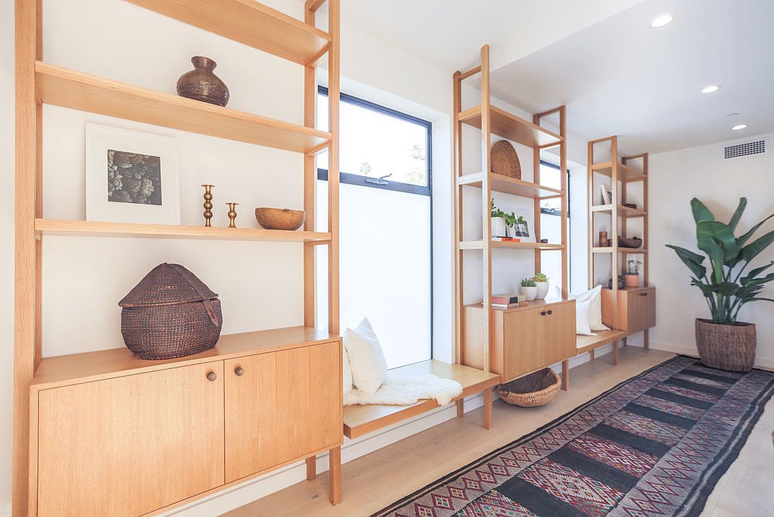 Bespoke-wooden-cabinets-coupled-with-breezy-window-seats-in-the-hallway