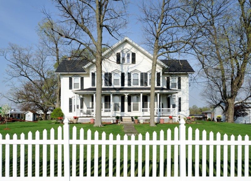 Big family house with a white picket fence