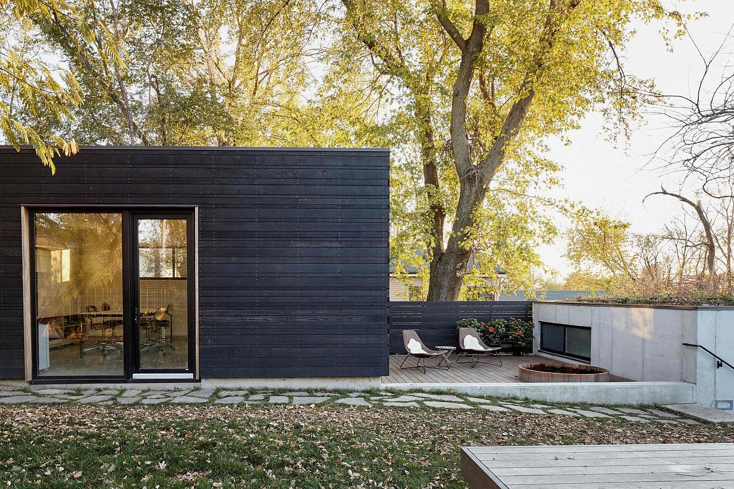 Black exterior and glass doors shape a stylish Kansas City home