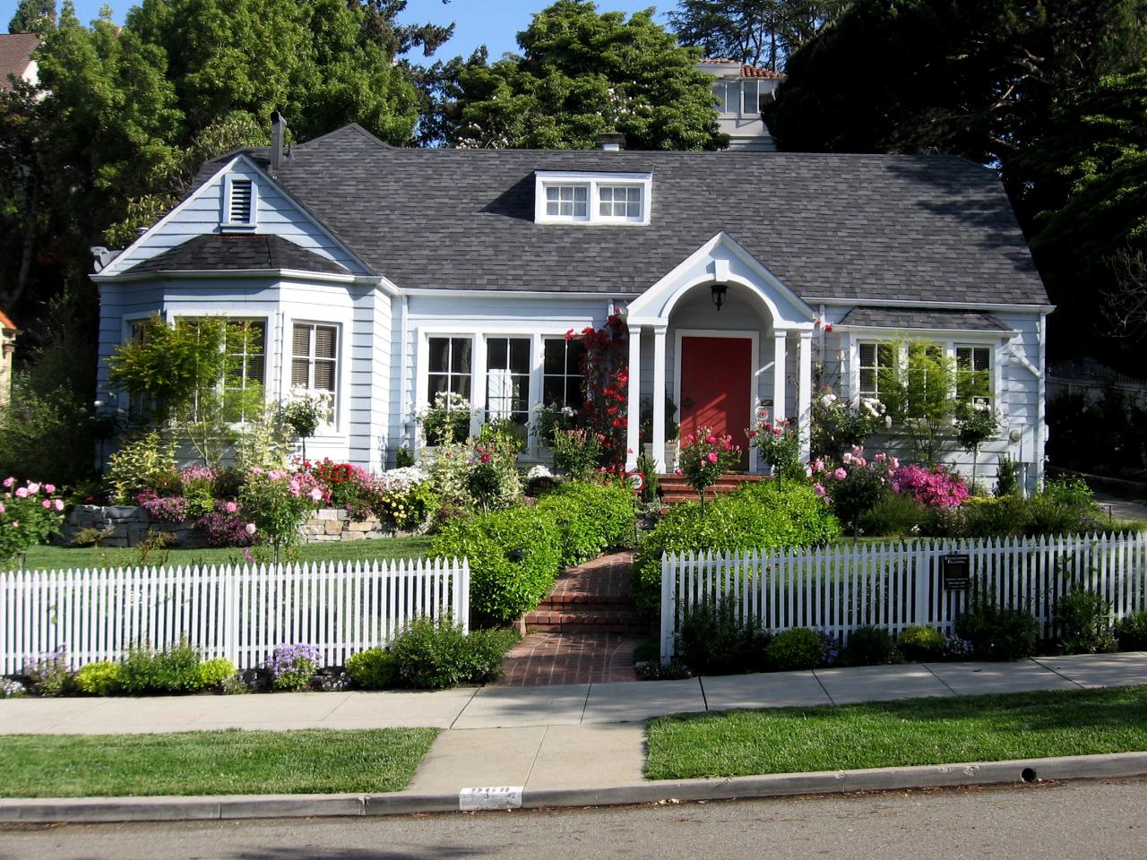 Blooming yard with a white picket fence