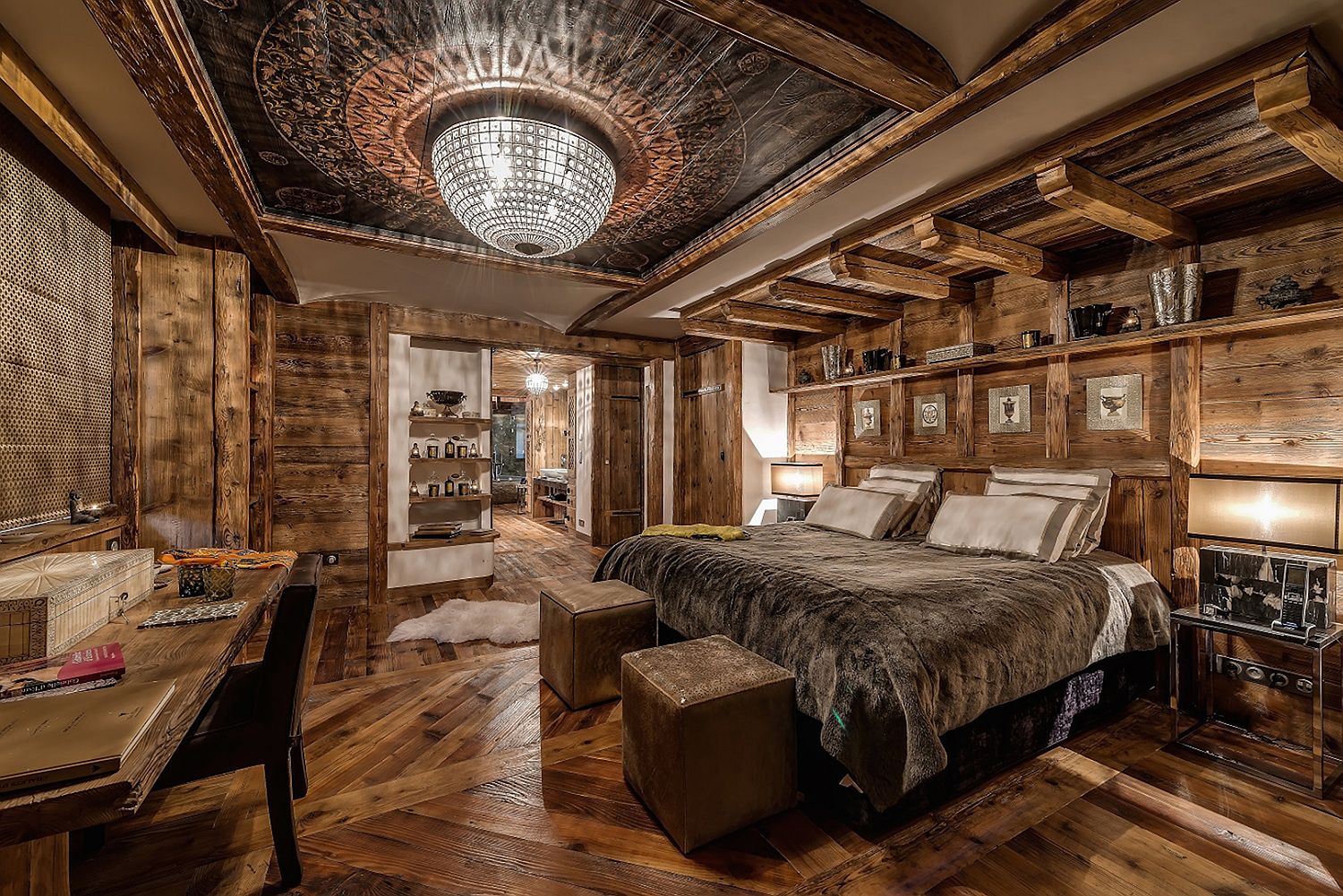 Breathtakingly beautiful chandelier steals the show inside this chalet bedroom