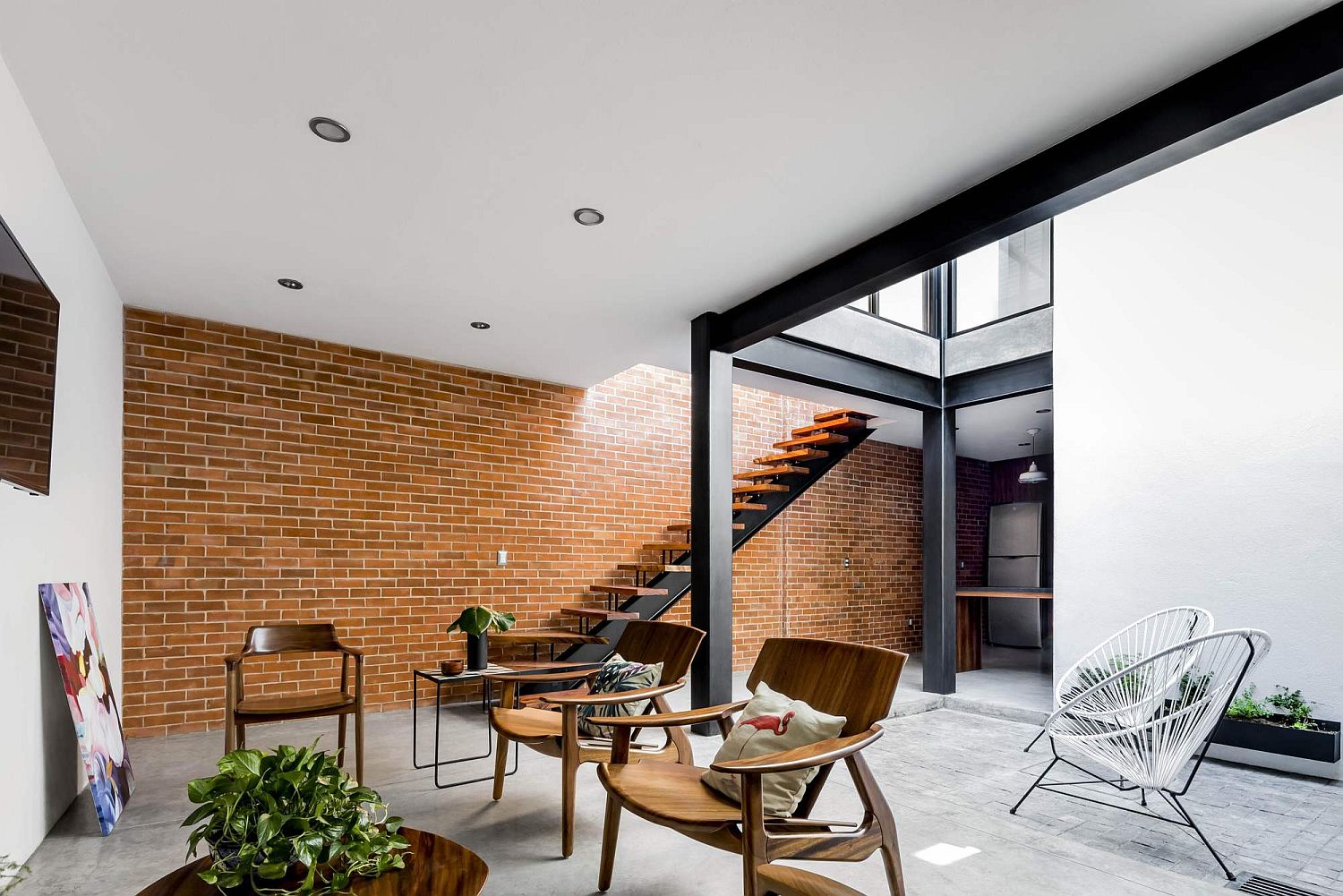 Exposed Brick Walls Steal The Show In This Modern Industrial Home   Brick Wall Brings Unique Textural Element To The Living Room 