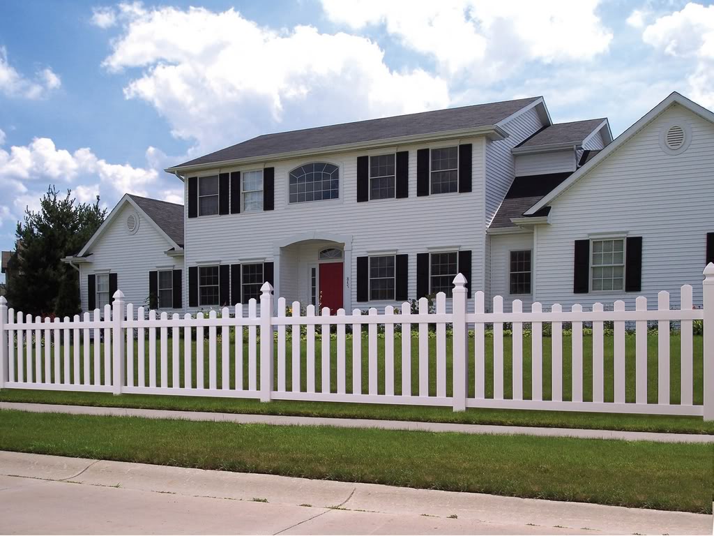 Classic suburban home with a white picket fence